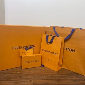 Authentic Louis Vuitton gift box set with bags and gift tags.